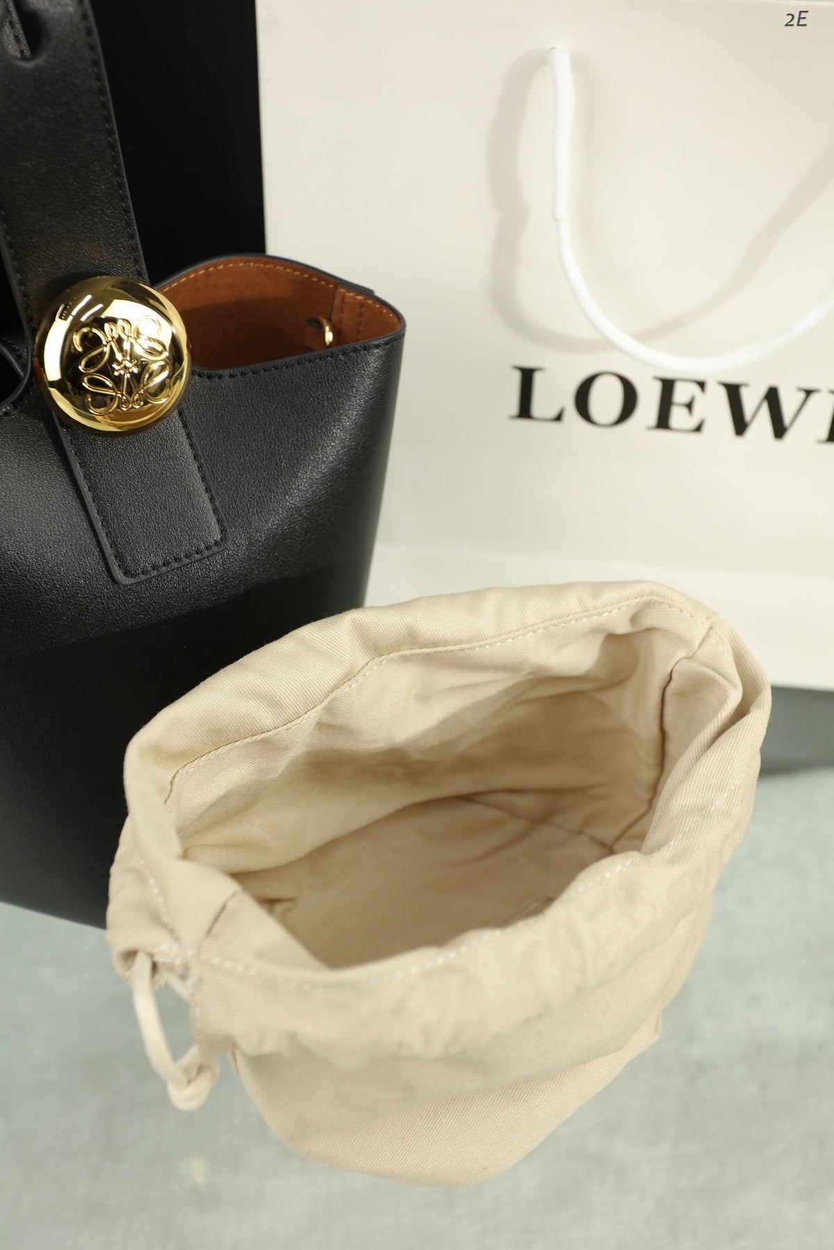Loewe Mini 19 Pebble Bucket in Black Mellow Calfskin